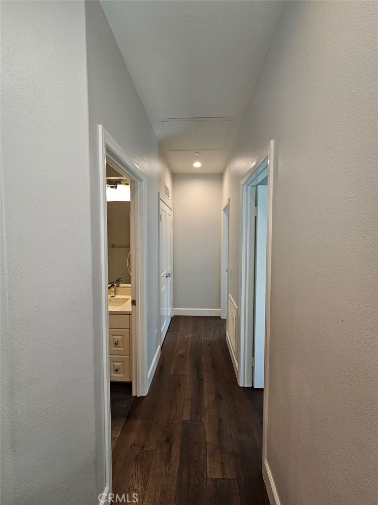 35 Courant Irvine, CA 92618 - Photo 13 of 37 a view of hallway with wooden floor