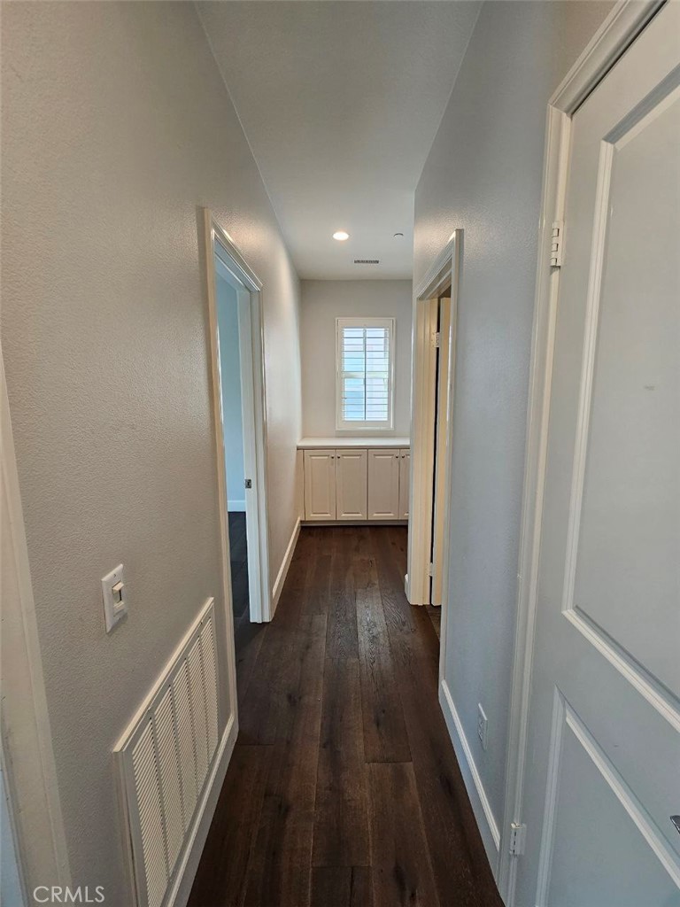 35 Courant Irvine, CA 92618 - Photo 14 of 37 a view of hallway with wooden floor