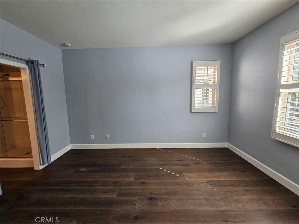 35 Courant Irvine, CA 92618 - Photo 18 of 37 a view of an empty room with wooden floor and a window