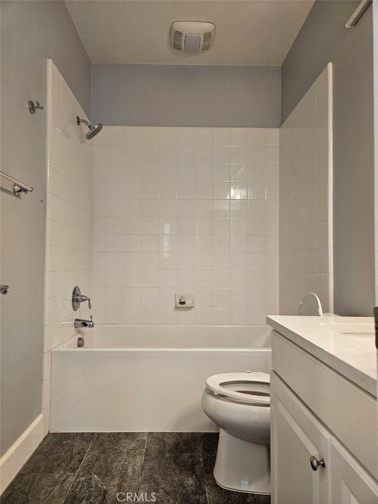 35 Courant Irvine, CA 92618 - Photo 25 of 37 a bathroom with a white toilet and a bathtub