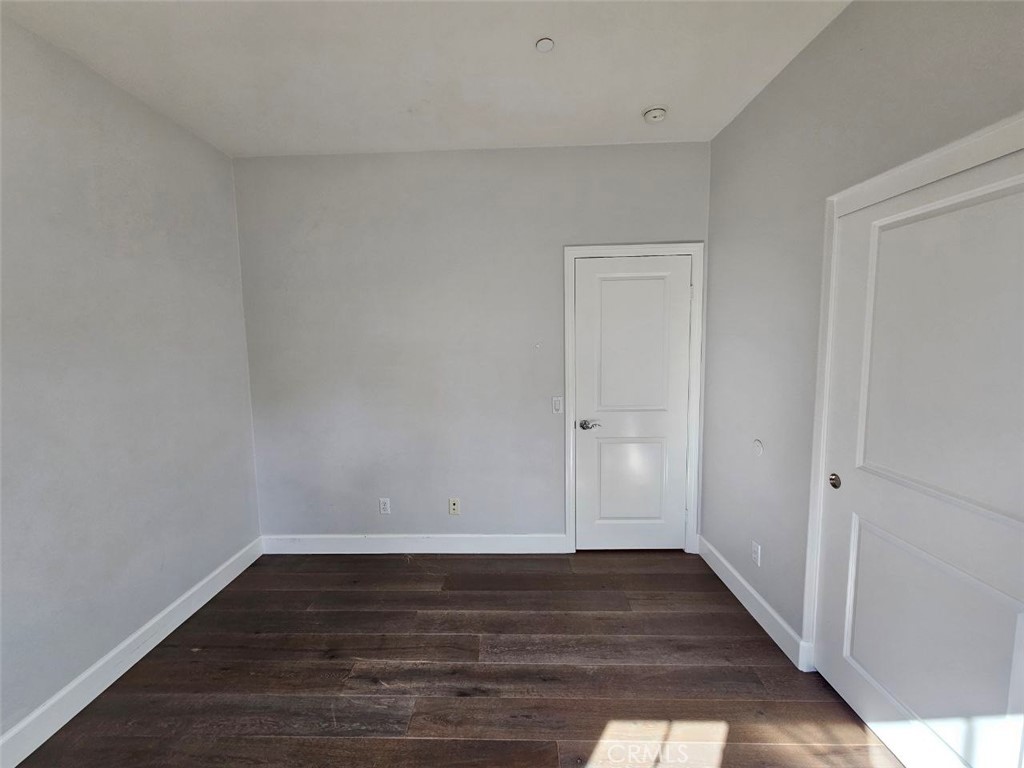 35 Courant Irvine, CA 92618 - Photo 29 of 37 a view of an empty room with wooden floor