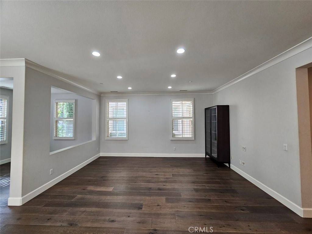 35 Courant Irvine, CA 92618 - Photo 5 of 37 an empty room with wooden floor and windows
