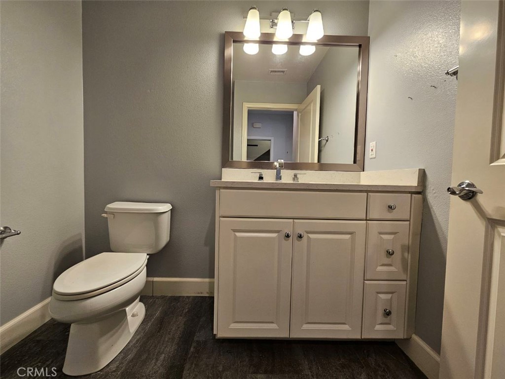 35 Courant Irvine, CA 92618 - Photo 10 of 37 a bathroom with a toilet sink and mirror
