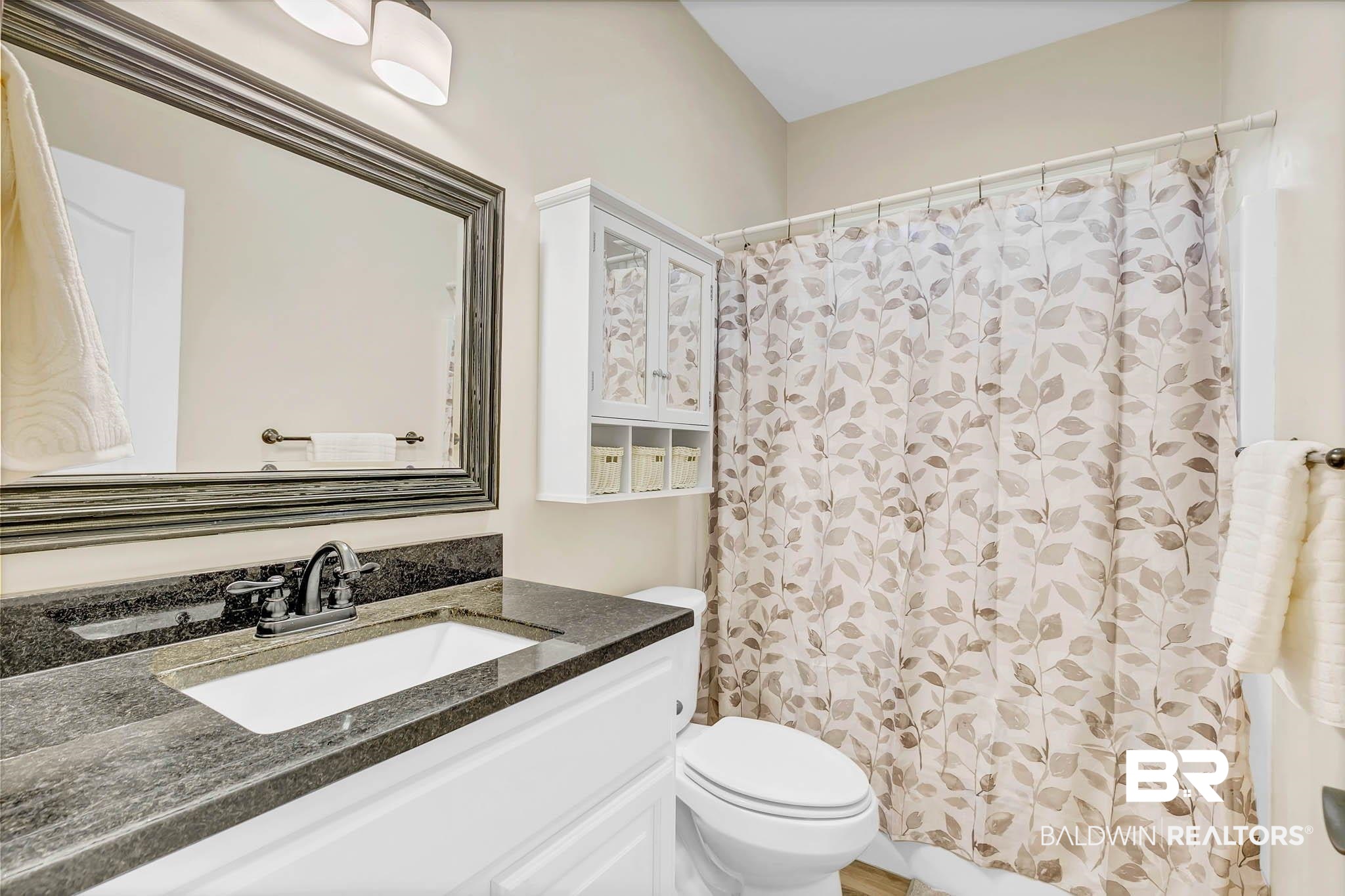 8145 Bay View Drive Foley, AL 36535 - Photo 48 of 81 Full bathroom featuring vanity and a shower with curtain