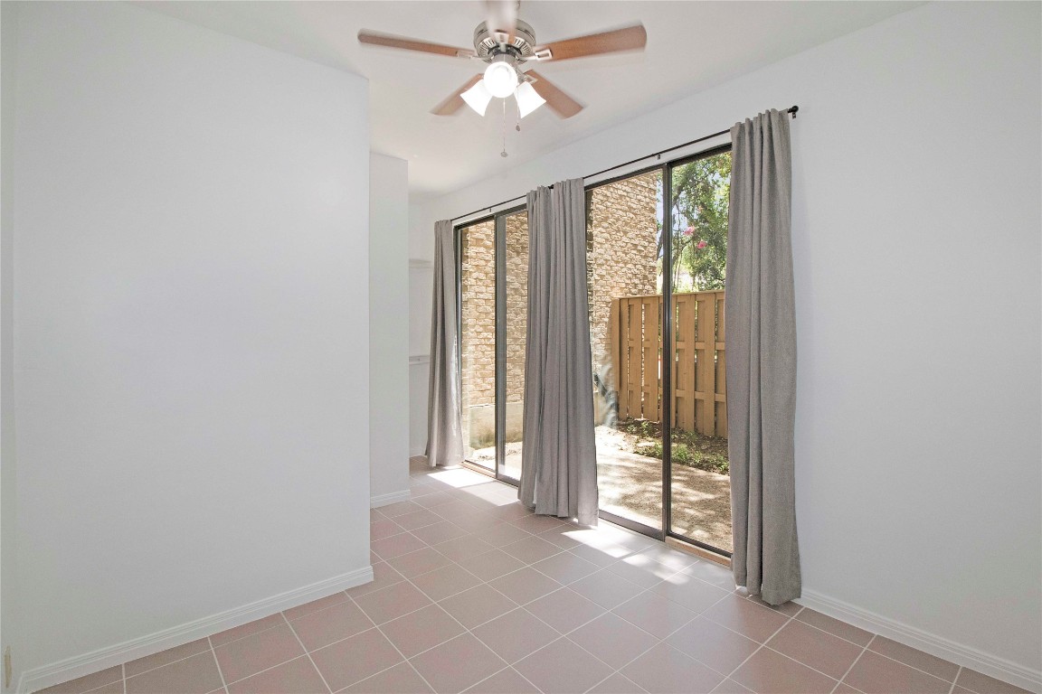 611 East 45th Street, Unit 8 Austin, TX 78751 - Photo 18 of 35 an empty room with windows and fan