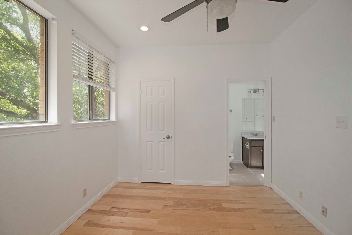 611 East 45th Street, Unit 8 Austin, TX 78751 - Photo 20 of 35 a view of an empty room with a window and a ceiling fan