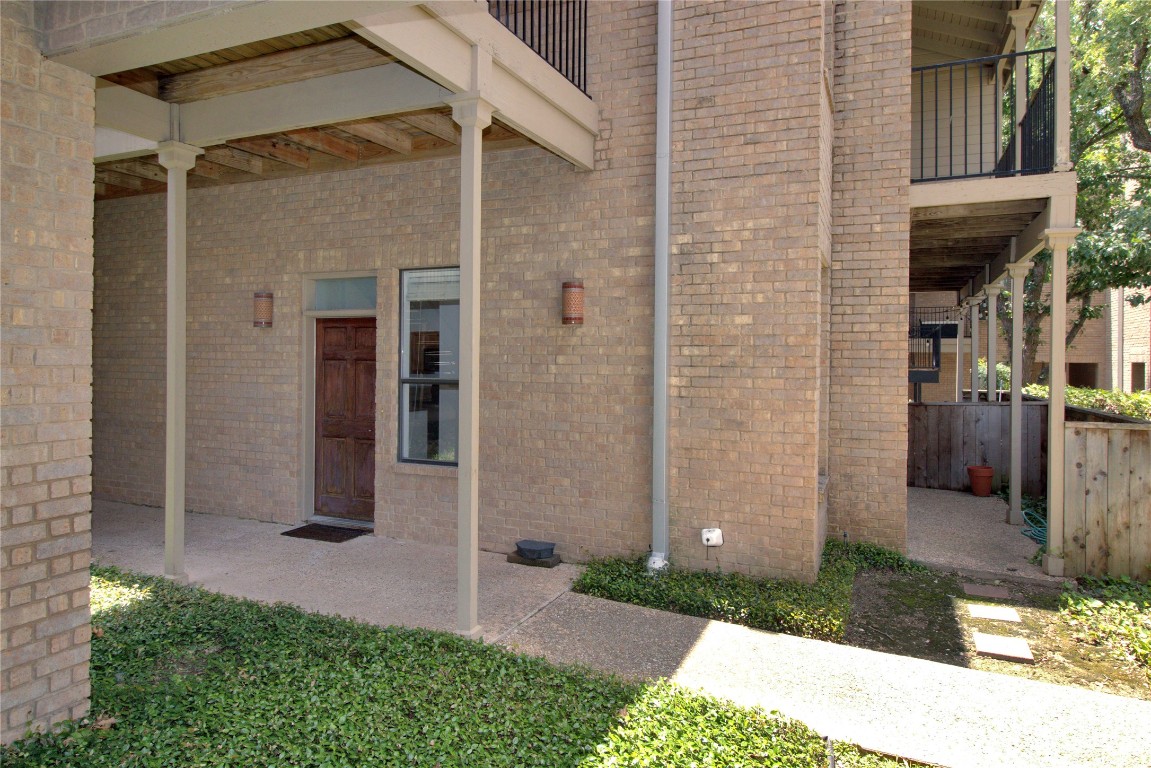 611 East 45th Street, Unit 8 Austin, TX 78751 - Photo 2 of 35 a front view of a house with a yard