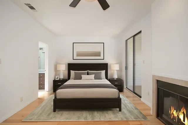 a bedroom with a bed and night stand