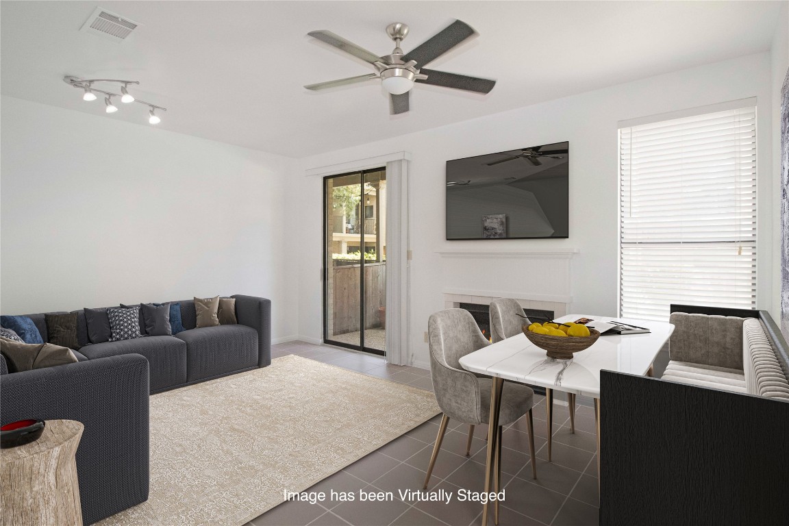 611 East 45th Street, Unit 8 Austin, TX 78751 - Photo 3 of 35 a living room with furniture and a flat screen tv