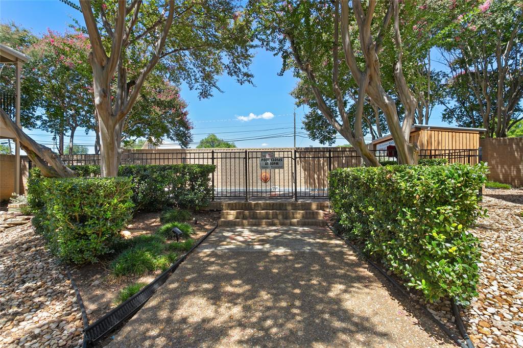 611 East 45th Street, Unit 8 Austin, TX 78751 - Photo 31 of 35 a front view of a house with a yard