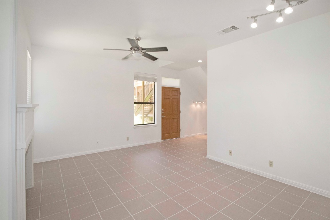 611 East 45th Street, Unit 8 Austin, TX 78751 - Photo 6 of 35 an empty room with windows and fan