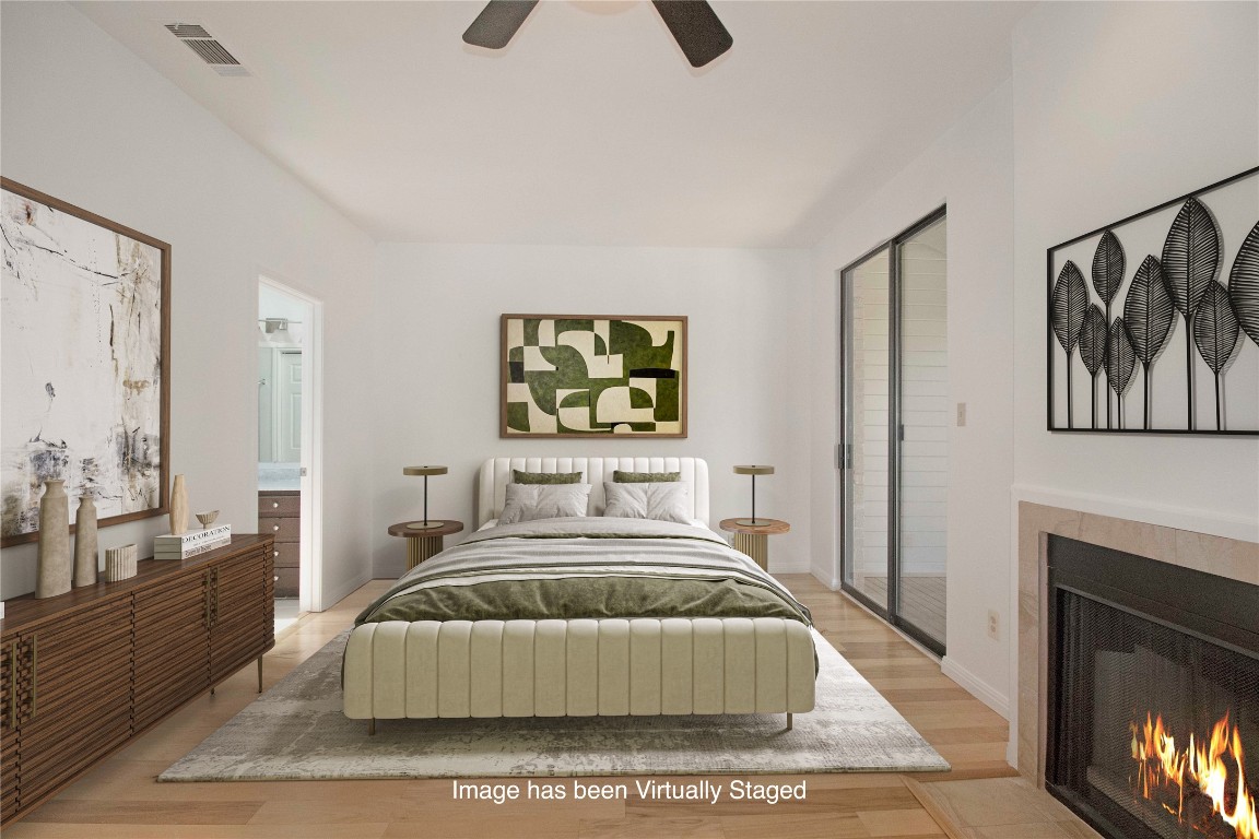 611 East 45th Street, Unit 8 Austin, TX 78751 - Photo 7 of 35 a bedroom with a bed and a couch