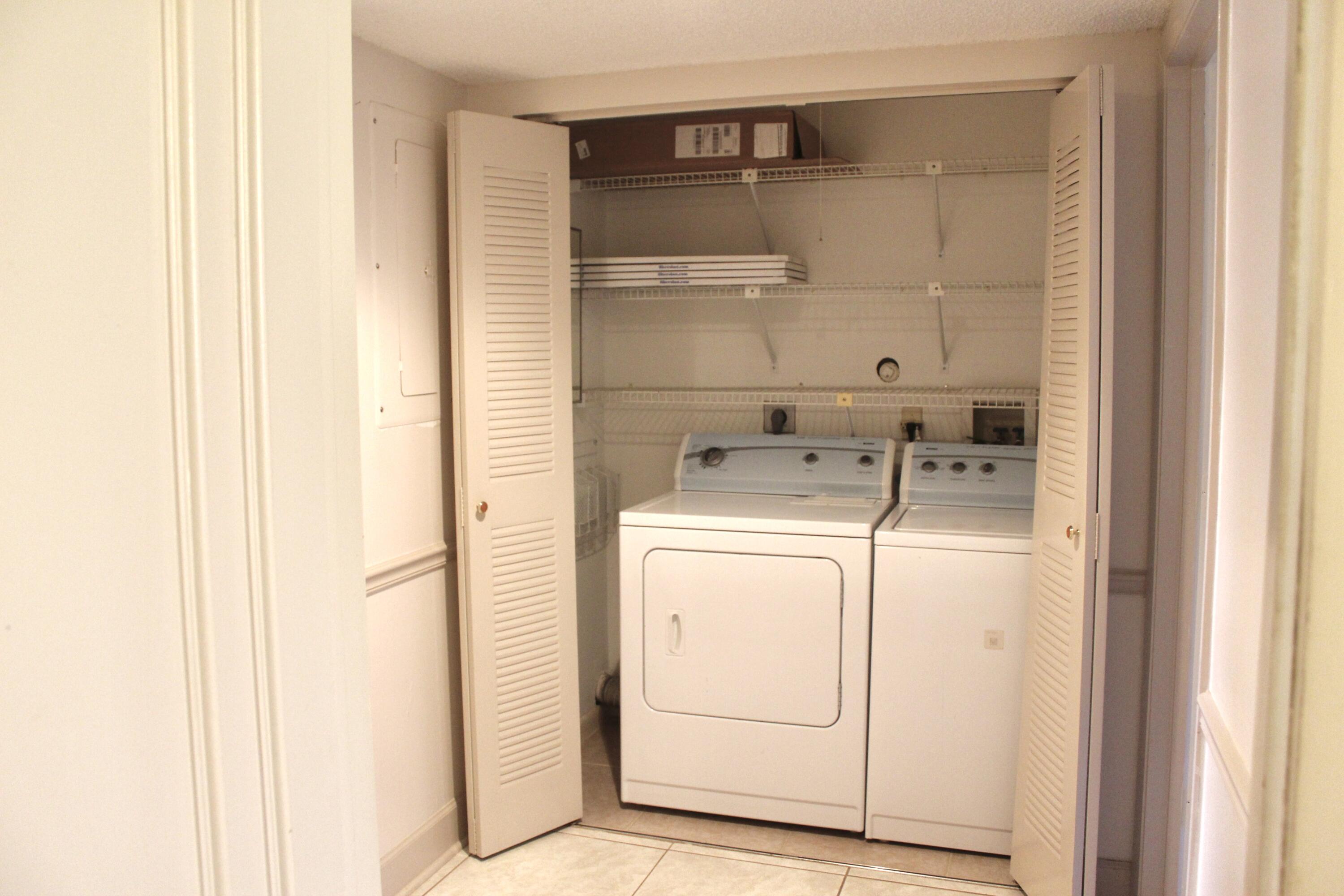 5130 Nesting Way, Unit C Delray Beach, FL 33484 - Photo 14 of 33 a utility room with dryer and washer