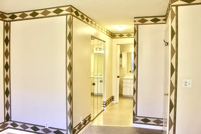 a bathroom with a shower and a glass door