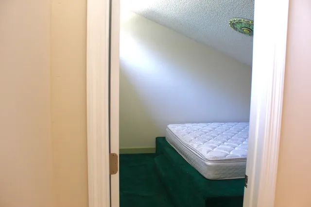 a view of a house with swimming pool and sitting area