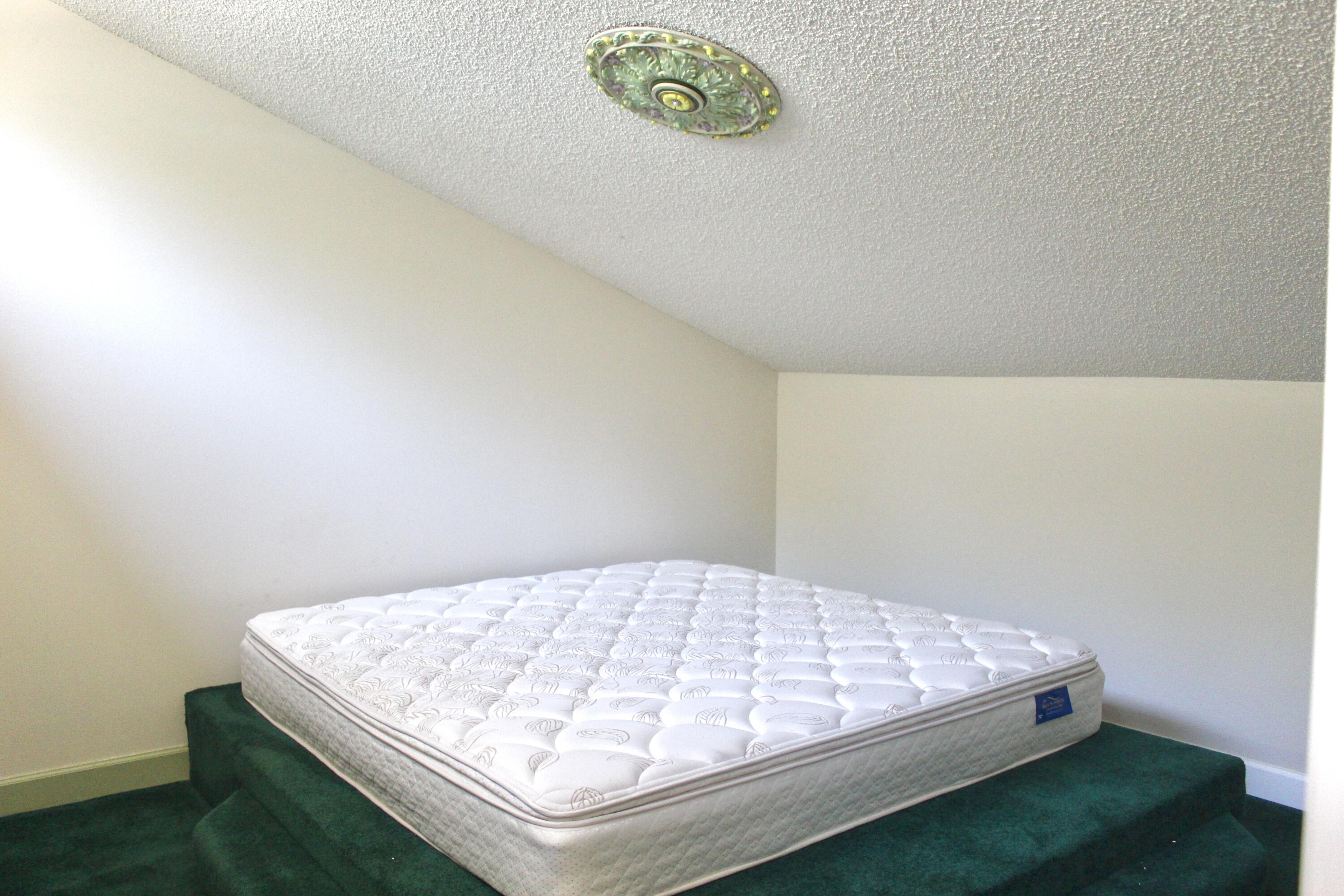 5130 Nesting Way, Unit C Delray Beach, FL 33484 - Photo 25 of 33 a view of a bed in a room