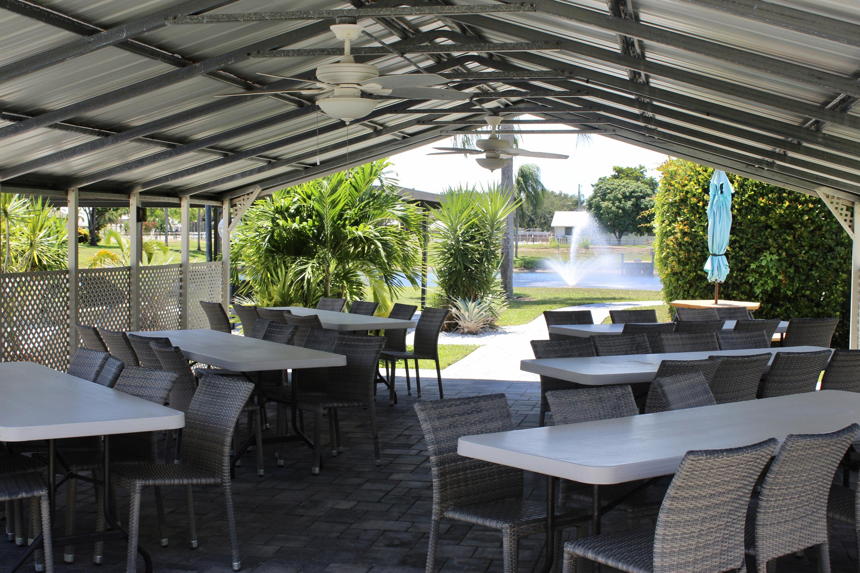 5130 Nesting Way, Unit C Delray Beach, FL 33484 - Photo 33 of 33 a outdoor dining space with furniture and outdoor view