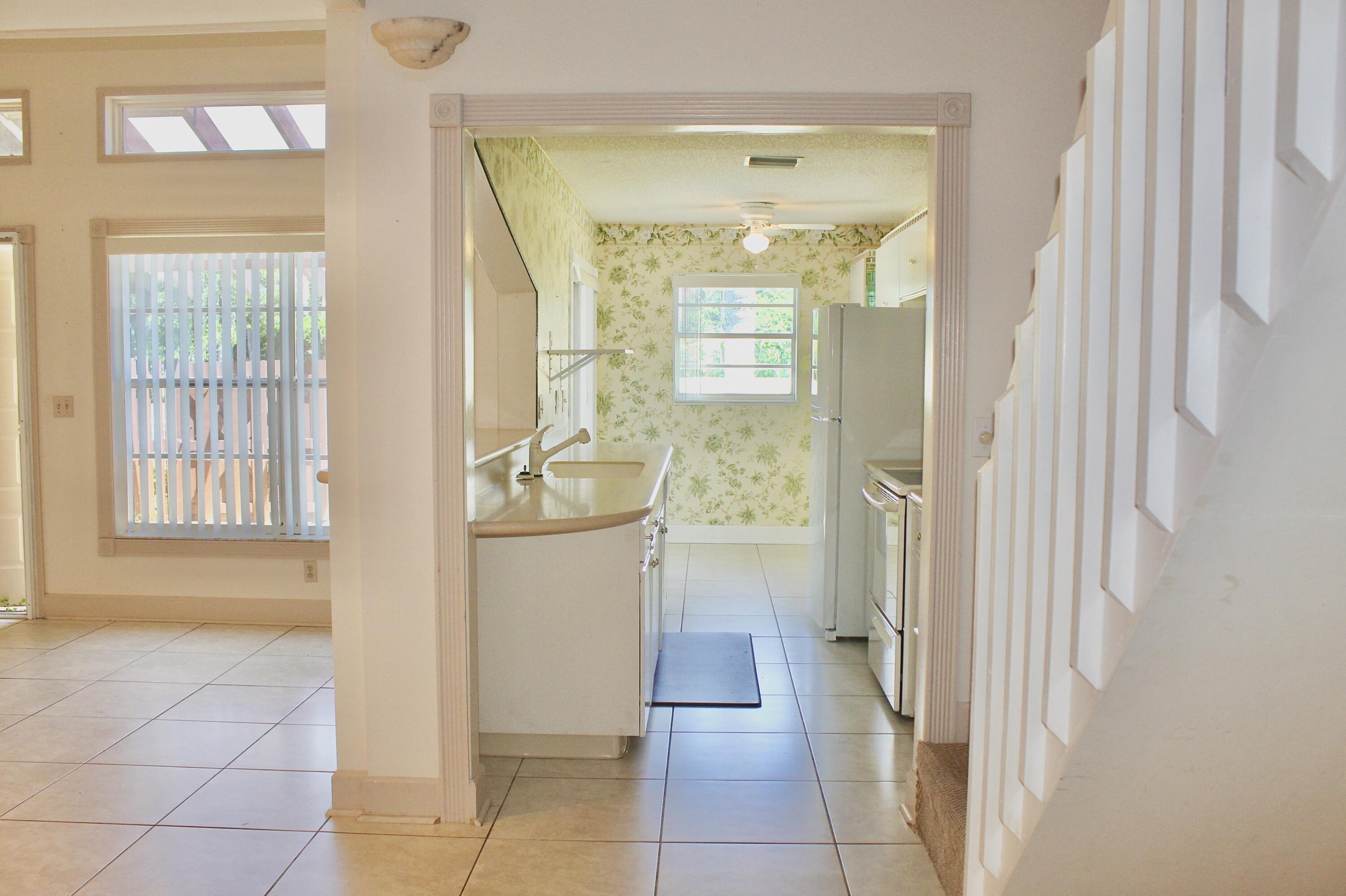 5130 Nesting Way, Unit C Delray Beach, FL 33484 - Photo 8 of 33 a bathroom with a tub and shower