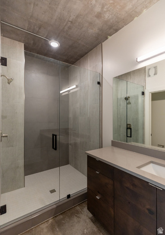 3667 Little Cottonwood Road, Unit 1 Sandy, UT 84092 - Photo 39 of 49 Full glass-enclosed shower with gray tiled walls and white mosaic floor