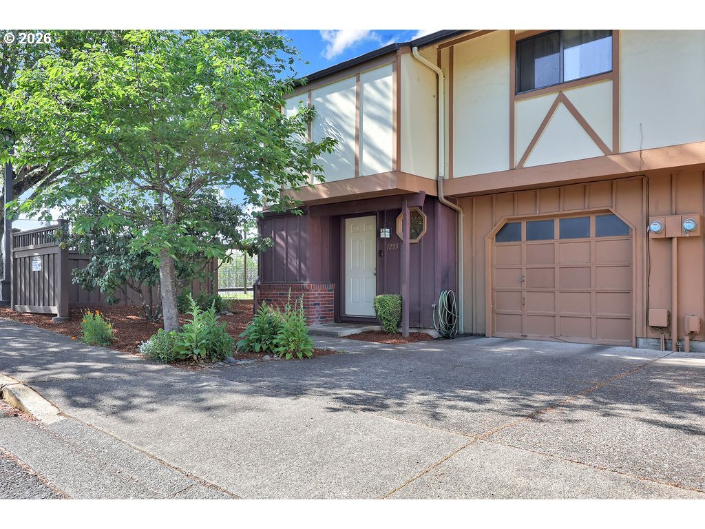 1253 City View Street Eugene, OR 97402 - Photo 1 of 18 a front view of a house with garden