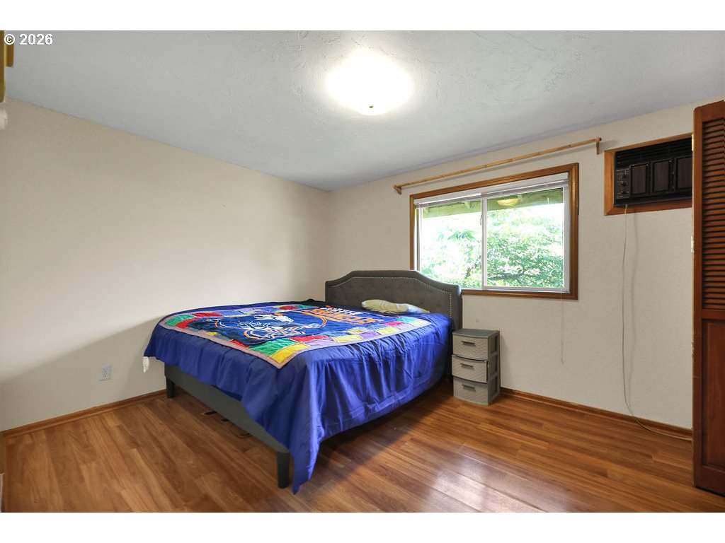 1253 City View Street Eugene, OR 97402 - Photo 13 of 18 a bedroom with a bed and a window