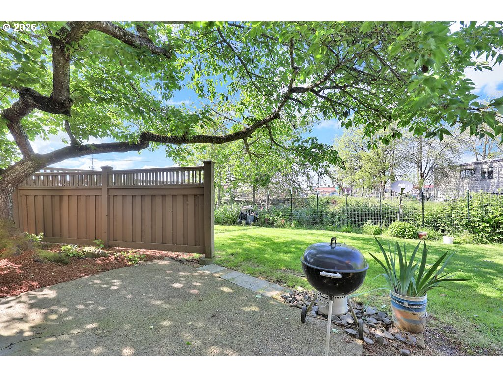 1253 City View Street Eugene, OR 97402 - Photo 14 of 18 a backyard of a house with table and chairs