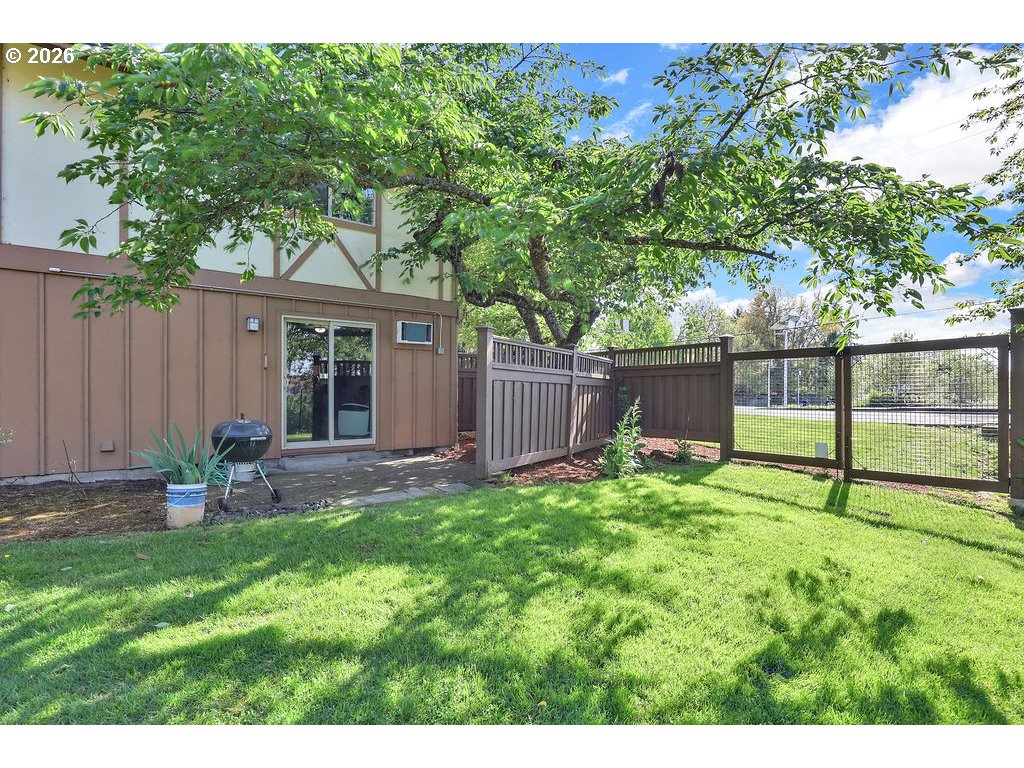 1253 City View Street Eugene, OR 97402 - Photo 17 of 18 a view of backyard with table and chairs and wooden fence