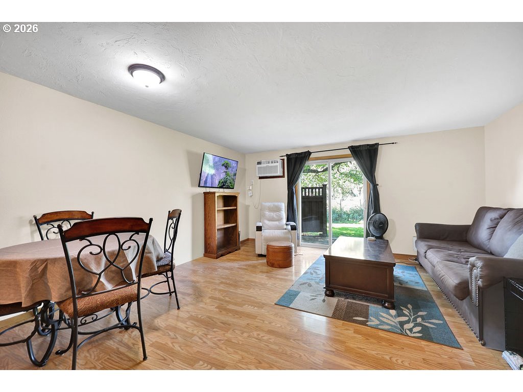 1253 City View Street Eugene, OR 97402 - Photo 8 of 18 a living room with furniture and a large window