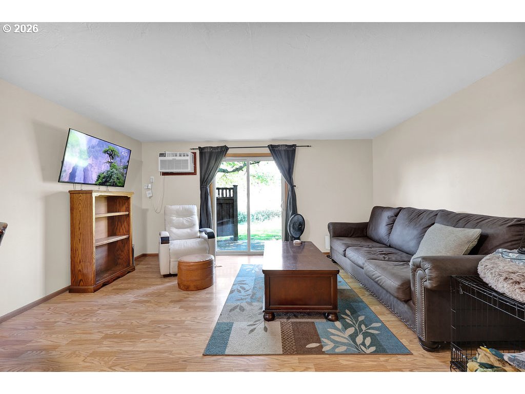 1253 City View Street Eugene, OR 97402 - Photo 9 of 18 a living room with furniture and a large window