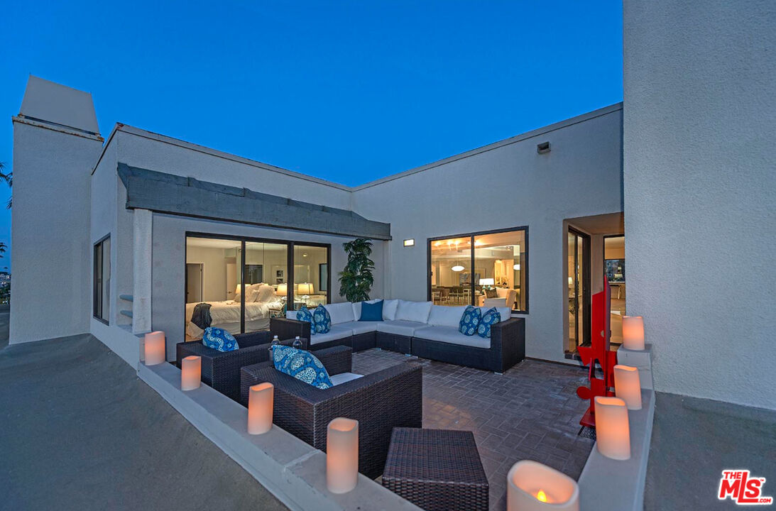 110 Ocean Park Boulevard, Unit 502 Santa Monica, CA 90405 - Photo 12 of 15 a living room with furniture and a flat screen tv