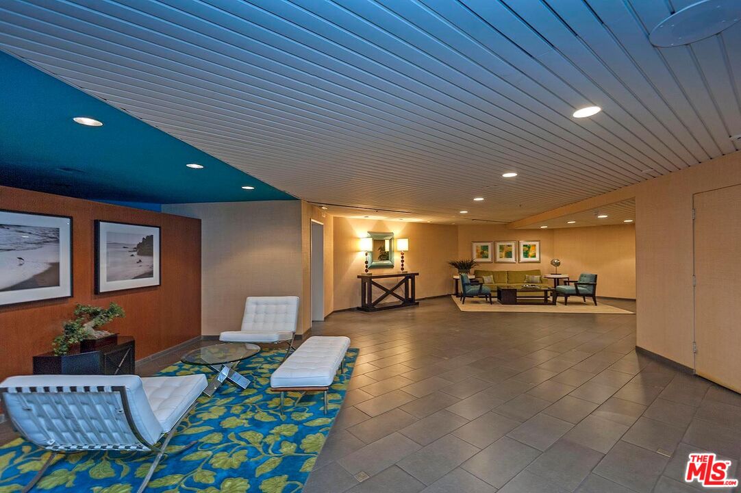 110 Ocean Park Boulevard, Unit 502 Santa Monica, CA 90405 - Photo 13 of 15 a living room with furniture and a flat screen tv