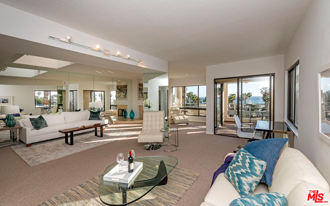 110 Ocean Park Boulevard, Unit 502 Santa Monica, CA 90405 - Photo 4 of 15 a living room with furniture and a large window