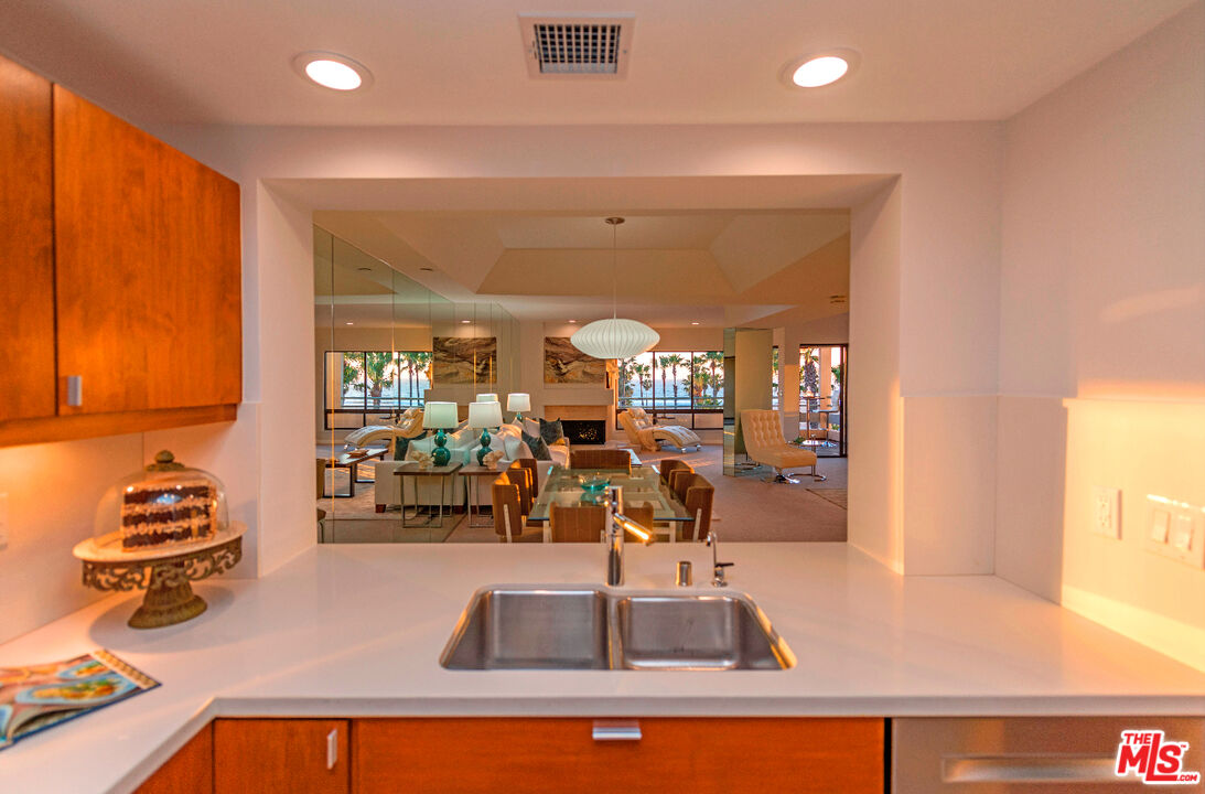 110 Ocean Park Boulevard, Unit 502 Santa Monica, CA 90405 - Photo 6 of 15 a view of a kitchen with kitchen island a large window