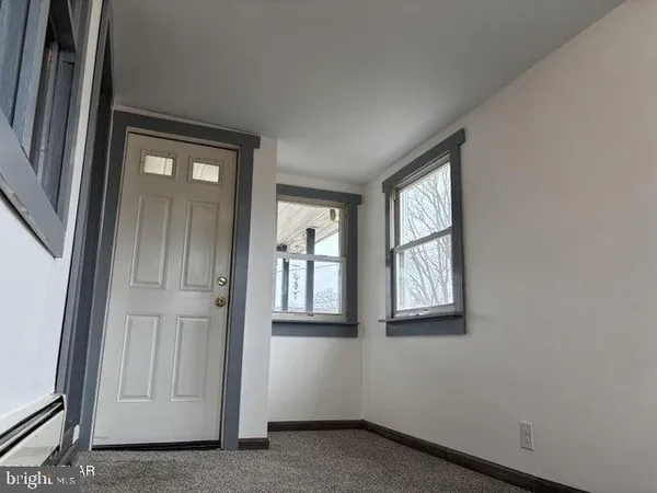 an empty room with windows