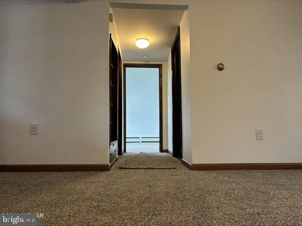 a view of a room with a hallway