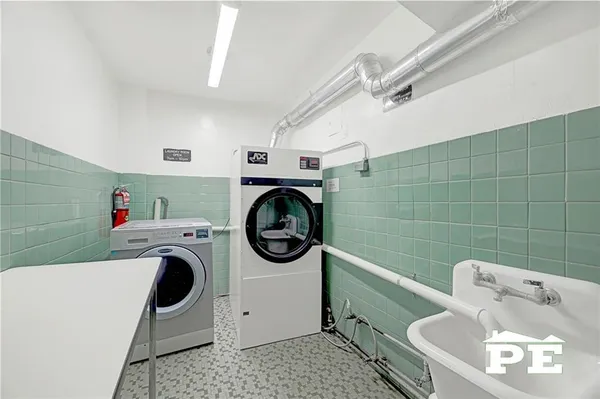 a utility room with dryer and washer