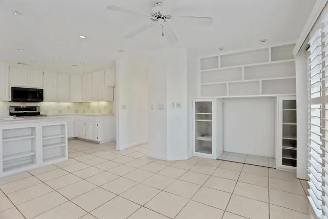 an aerial view of a house with a yard basket ball court and outdoor seating