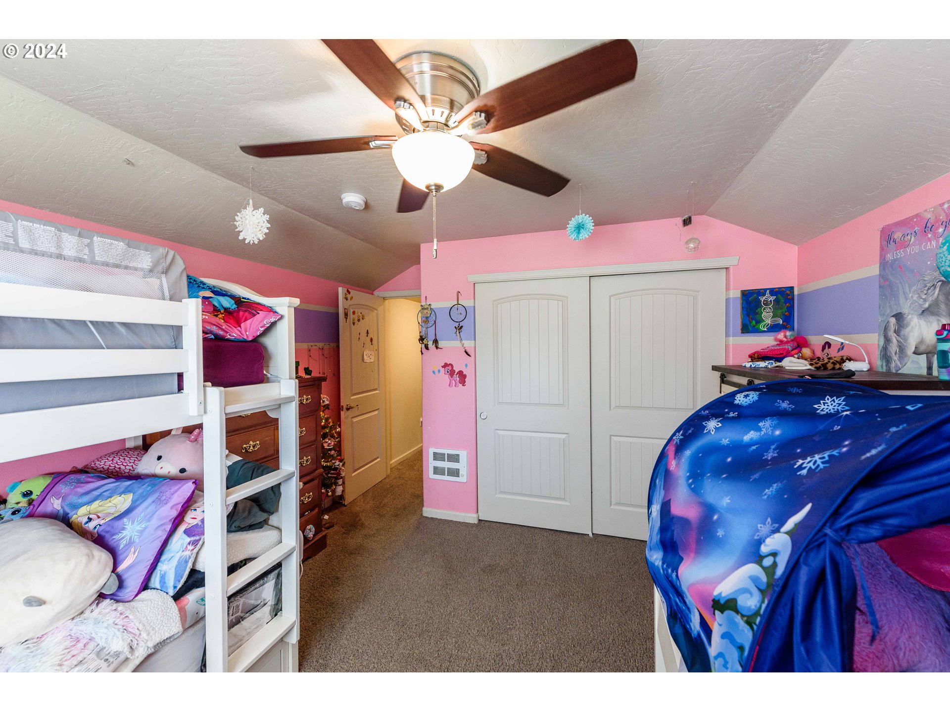 63464 James Drive Coos Bay, OR 97420 - Photo 13 of 25 a bedroom with a bed and a white cabinets