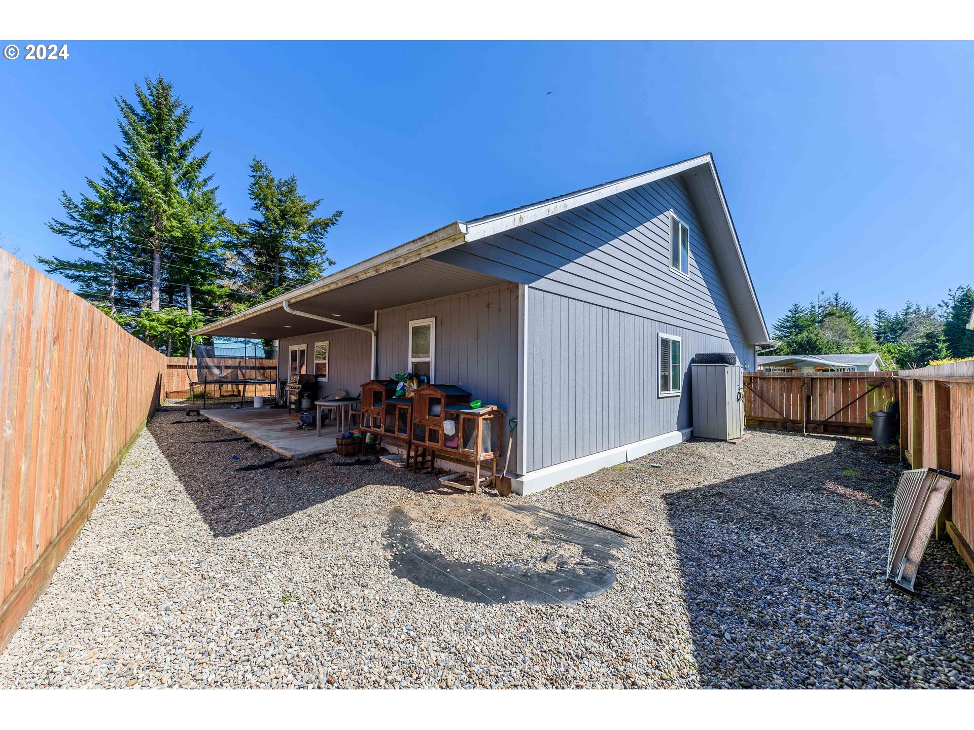 63464 James Drive Coos Bay, OR 97420 - Photo 17 of 25 a view of a house with backyard and sitting area