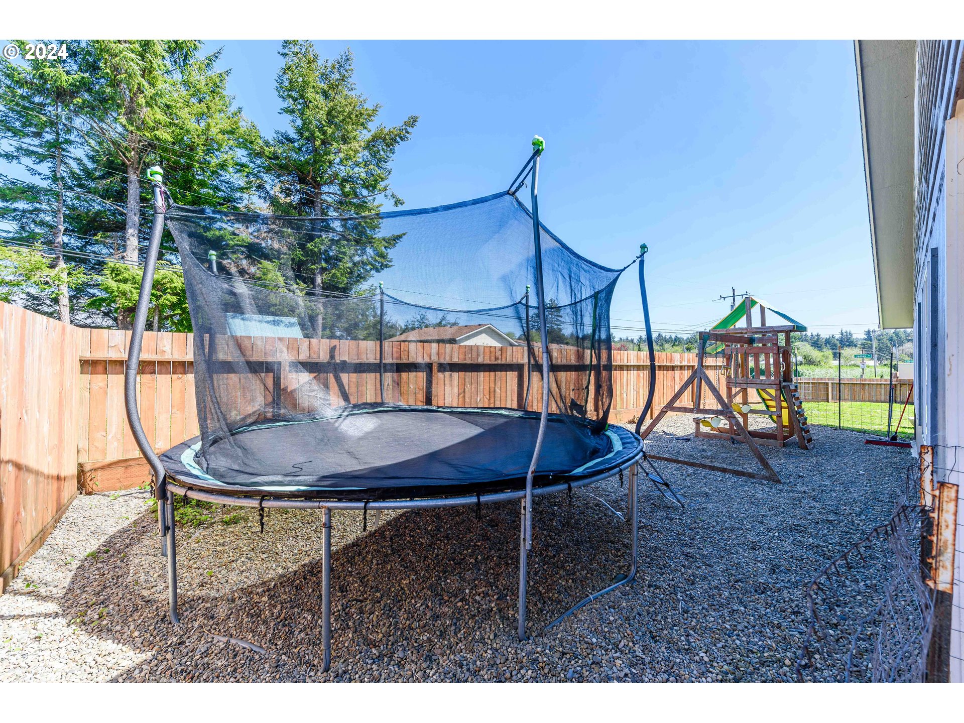 63464 James Drive Coos Bay, OR 97420 - Photo 19 of 25 a backyard of a house with table and chairs