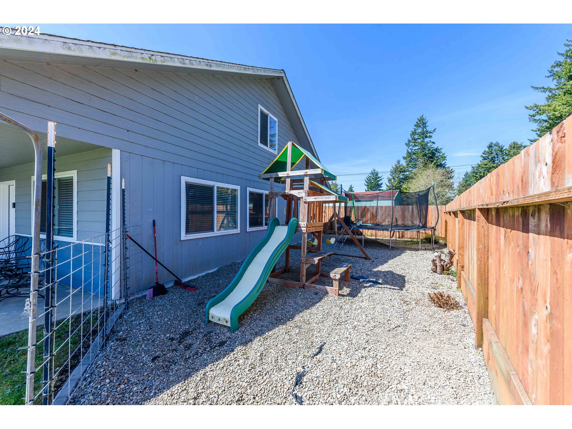 63464 James Drive Coos Bay, OR 97420 - Photo 20 of 25 a view of a house with a wooden deck
