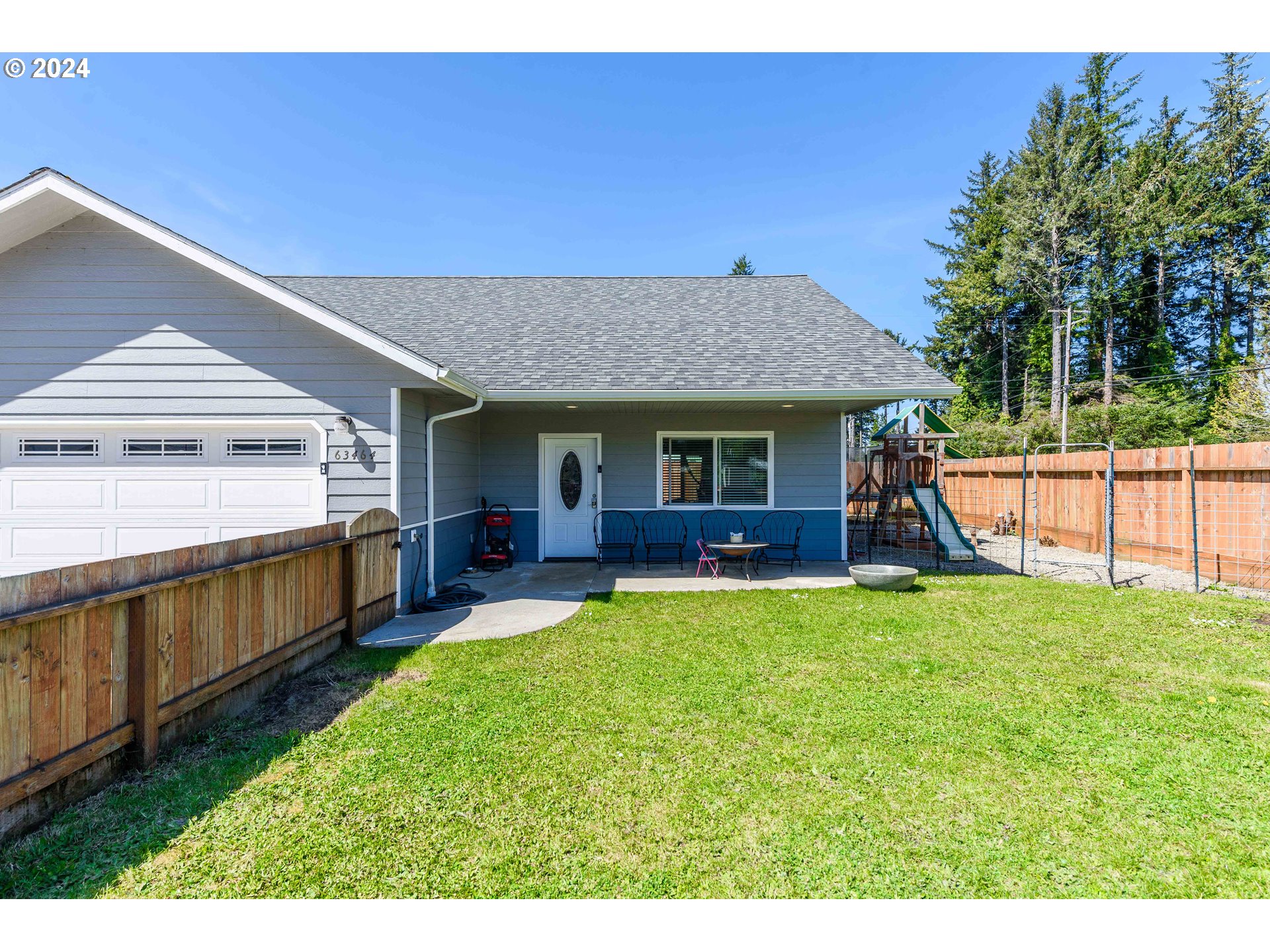 63464 James Drive Coos Bay, OR 97420 - Photo 21 of 25 a view of a house with a yard porch and sitting area