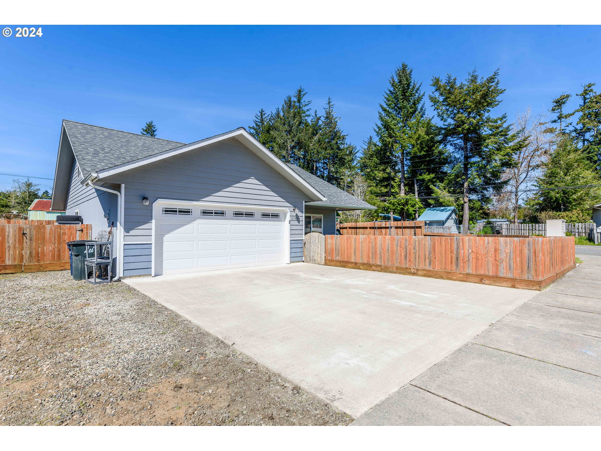 63464 James Drive Coos Bay, OR 97420 - Photo 23 of 25 a view of backyard of house with garage