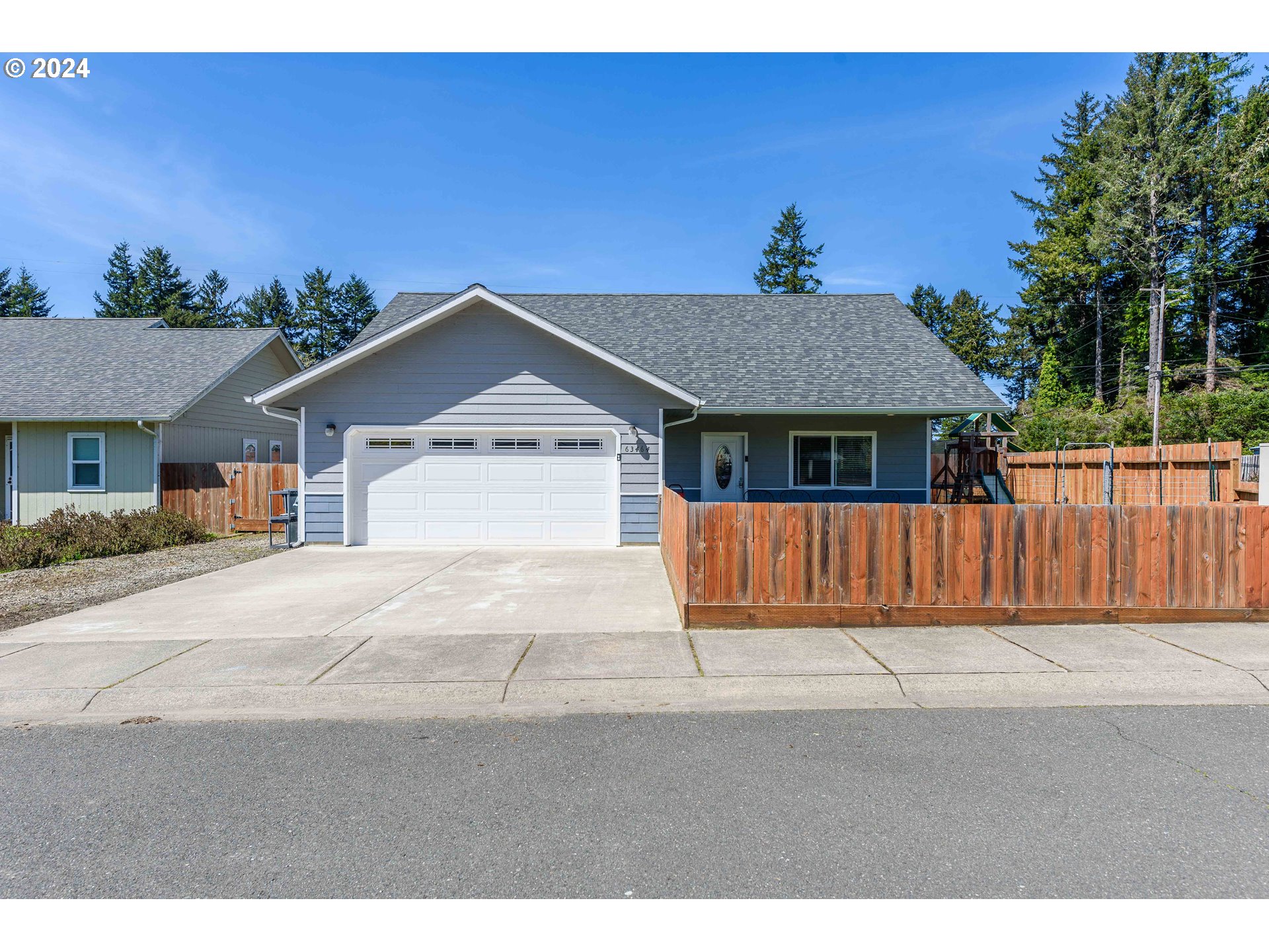 63464 James Drive Coos Bay, OR 97420 - Photo 24 of 25 a front view of a house with a yard