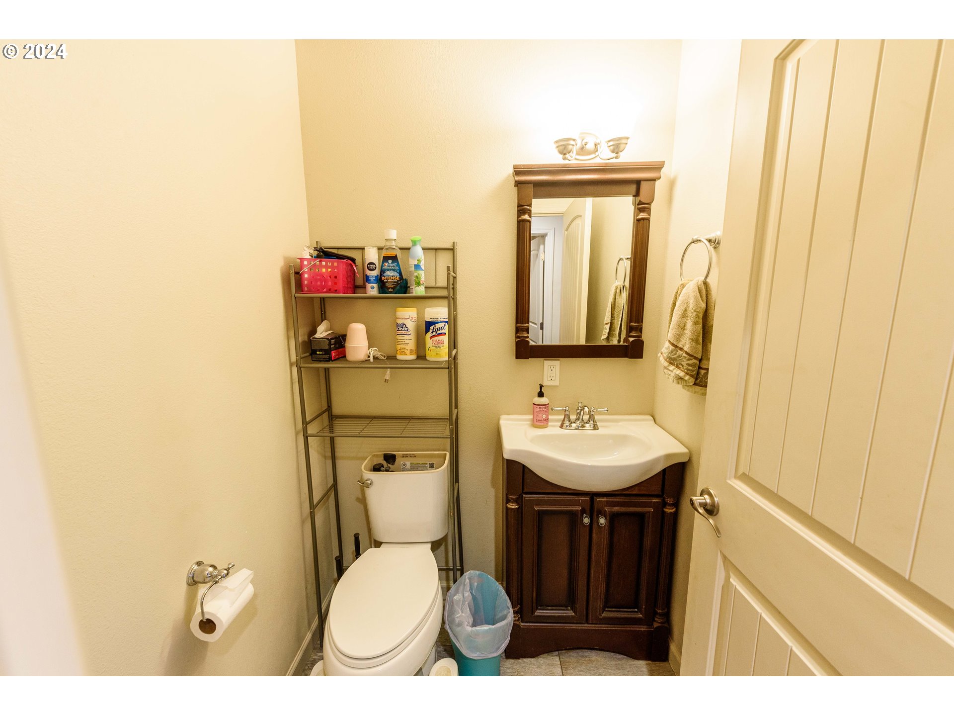63464 James Drive Coos Bay, OR 97420 - Photo 9 of 25 a bathroom with a toilet sink and mirror