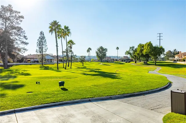 a view of a swimming pool with an outdoor space and seating area