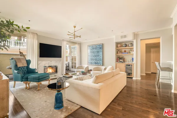 a living room with fireplace furniture and a flat screen tv