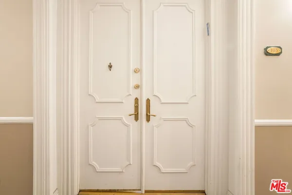 a bathroom with a glass shower door