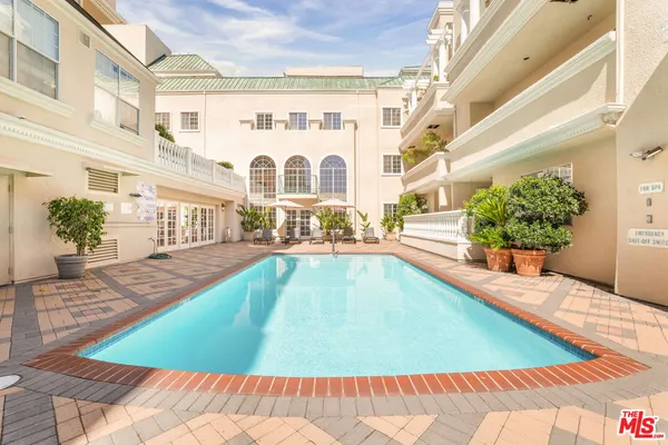 a view of a swimming pool with an outdoor space