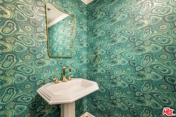 a bathroom with a sink and mirror